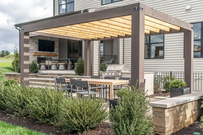 a patio with a table and chairs