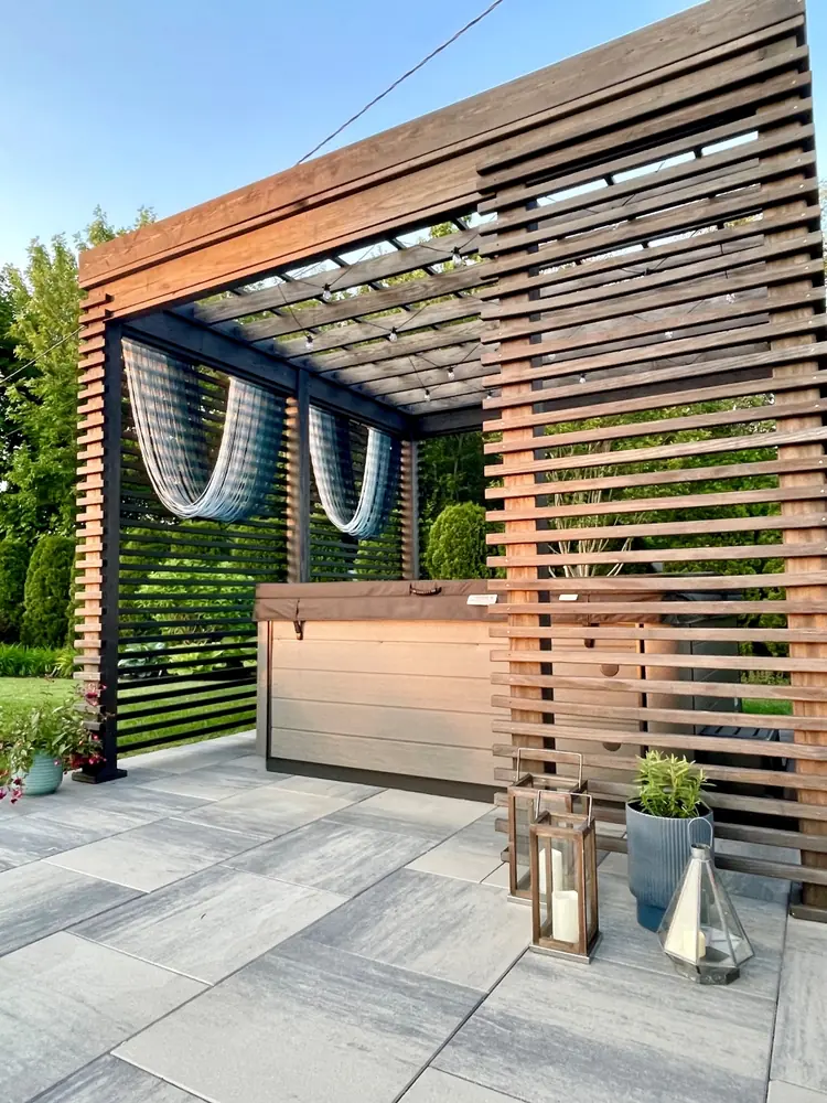 a wooden structure with a hot tub and a hot tub